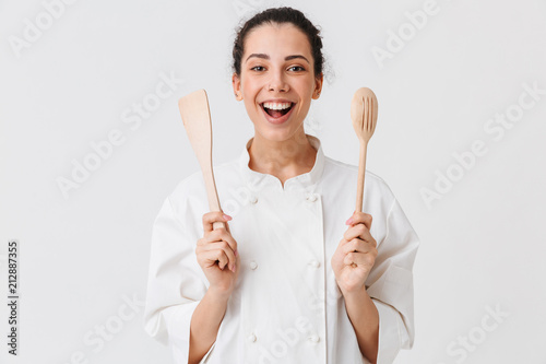 Portrait of a cheerful young woman cook