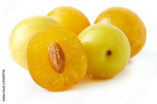 Yellow cherry plums also known as mirabelle plums isolated on white background