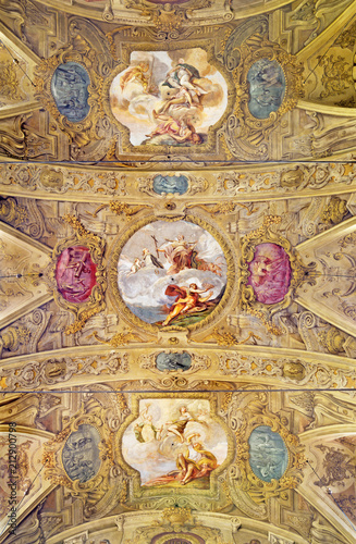 MODENA, ITALY - APRIL 14, 2018: The baroque ceiling fresco with scenes fom live of St. Barbara in church Chiesa di San Barnaba by Sigismondo Caula and Antonio Mannini from begin of 18. cent.