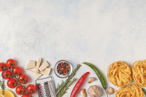 Italian food background with pasta, spices and vegetables.