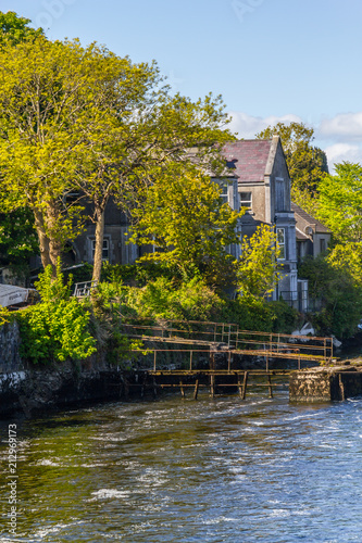 Old House on side Corrib River and trees