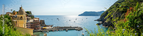Panoramic View of the Bay in front of the Town of Vernazza on Blue Sky Background.