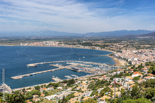 Looking across the rooftops of Roses to the beach and port on Cape Creus Costa Brava