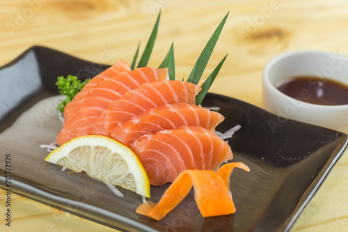 Salmon sashimi with withe plate isolated on white background