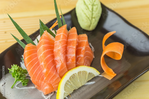 Salmon sashimi with withe plate isolated on white background