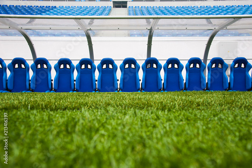 Blue bench or seat or chair of staff coach in the stadium of football