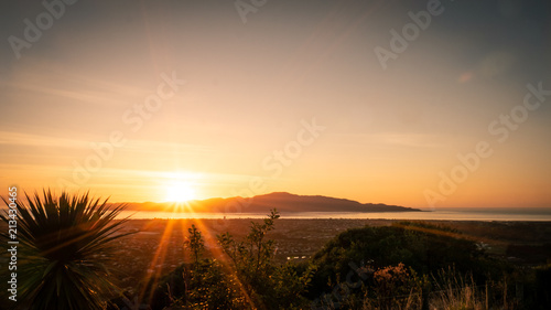 Sunset captured on the hills in Paraparaumu near Wellington, Kapiti coast, North Island of New Zealand. Kapiti Island in front