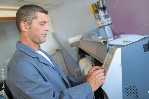 Man programming printing machine