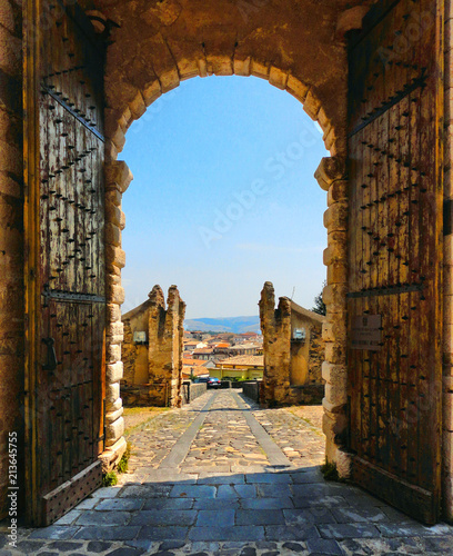 wooden open gate with view over city in medieval castle on the hill in little town Melfi, Basilicata Italy 