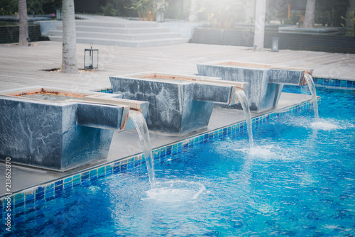 Waterfall jet at the swimming pool on daytime.