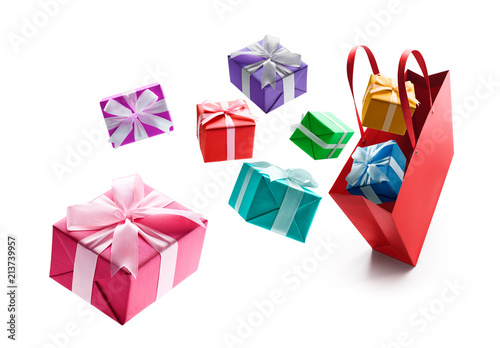 Gift boxes pop out from red shopping bag