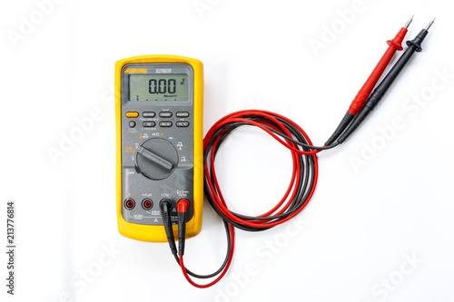 Yellow Digital multimeter with probes on white background , A multimeter is an electronic measuring instrument.