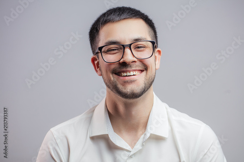 carefree positive male in glasses. cheerful man rejoicing at the good business news