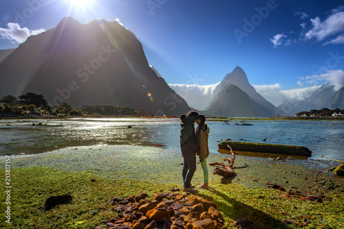 couple lover in romantic sweet honeymoon in milford sound, popupar tourist place and famous for travelling