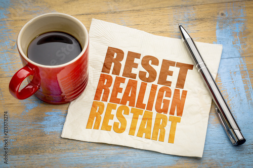 reset, realign, restart concept on napkin