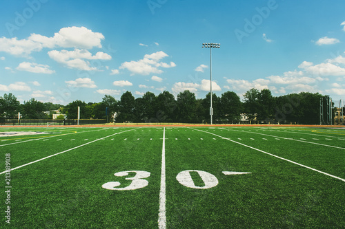 30 Yard Line on American Football Field and blue sky