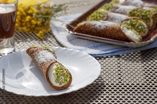 Canoli, typical sicilian dessert, arranged in a plate