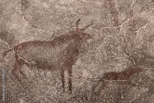 An image of ancient mammalian animals on a cave wall painted by ancient people. history, archeology.