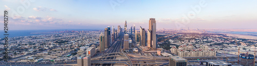 DUBAI, UAE - FEBRUARY 21, 2014. Panorama aerial view on Dubai main street - Sheikh Zayed Road and skyscrapers in evening on sunset