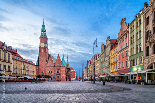 Colorful houses and historic Town Hall building on Rynek square at dusk in Wroclaw, Poland