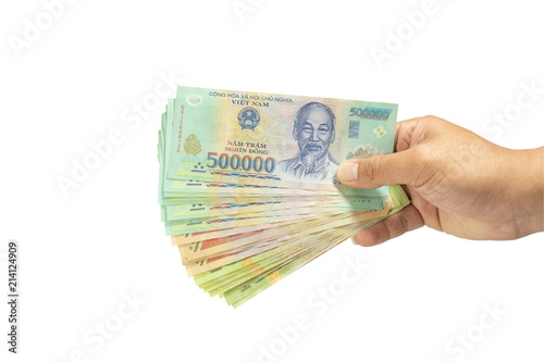 clipping path Money in Vietnam on hand (Socialist Republic Of Vietnam), Dong, VND, Pay, exchange money isolated on white background.