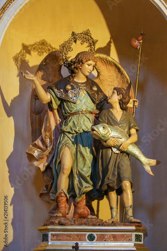 Statues of an Angel and Jesus as a Child holding a big Fish