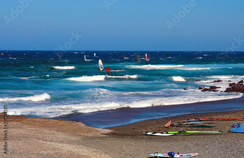 Wind serfing and blue sea in the background. Summer vacation concept.