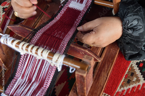 Hands of an arabian female weaver