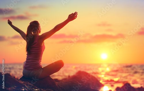 Relaxation And Yoga At Sunset - Girl With Open Arms Looking Ocean 