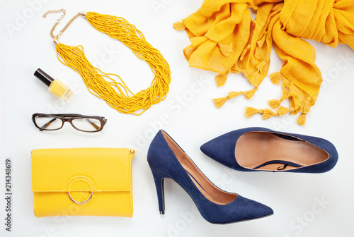 Bright yellow accessories and blue shoes for girls and women. Urban fashion, beauty blog concept