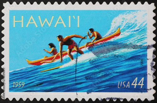 Stamp representing surfer & canoe in Hawaii islands