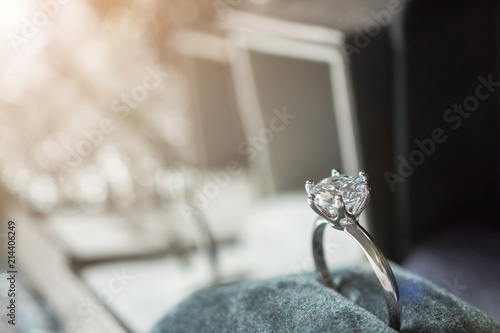 luxury engagement Diamond ring in jewelry gift box with bokeh light background