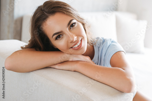 Close up of a smiling young woman relaxing