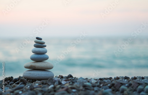 made of stone tower on the beach and blur background