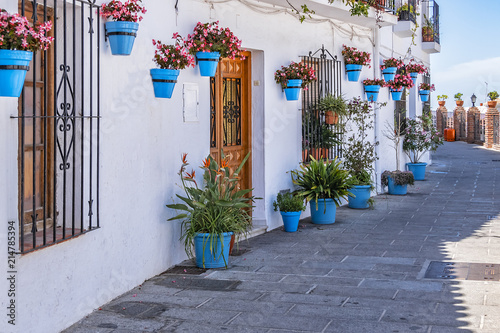 Beautiful view of old Mijas Calle Moro (Moro Street). Mijas (not far from Malaga) - Spanish hill town overlooking the Costa del Sol, known for its white-washed buildings. Mijas, Andalusia, Spain.