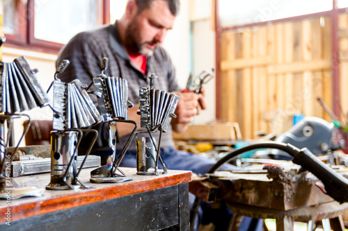 Figures of accordion, music performers made of welded metal wire