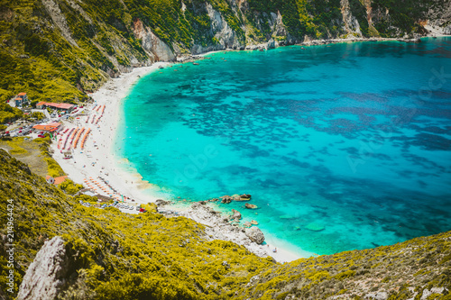 Myrtos beach with azure blue sea water in the bay. Favorite tourist visiting destination place at summer on Kefalonia island, Greece, Europe