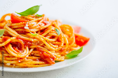 Pasta dish with tomato sauce on white plate