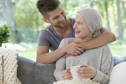 Happy husband hugging his recovering wife