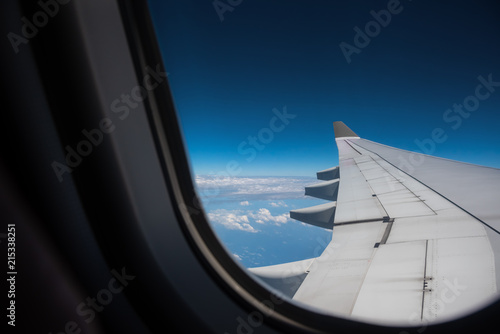 aircraft window with blue sky.