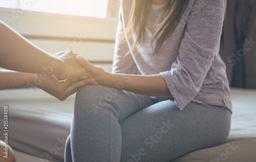 Psychiatrist holding hands woman patient,Mental health care concept