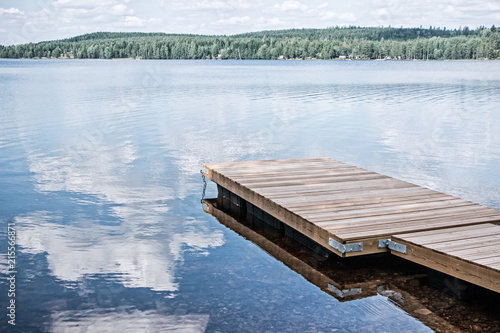 landscape of wooden dock floating in lake at sweden countryside