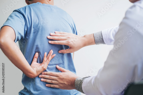 Doctor consulting with patient Back problems Physical therapy concept