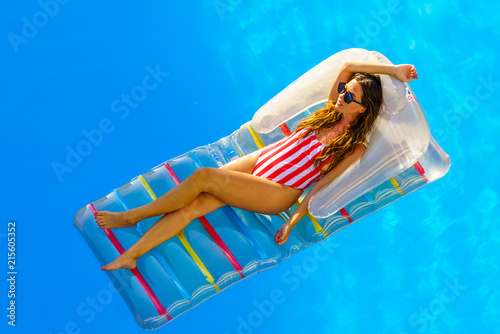 amazing beautiful girl in bikini on an air mattress