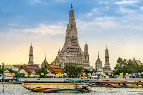 Longtail boats on the Chao Phraya River at the Temple of Dawn, Wat Arun, Bangkok