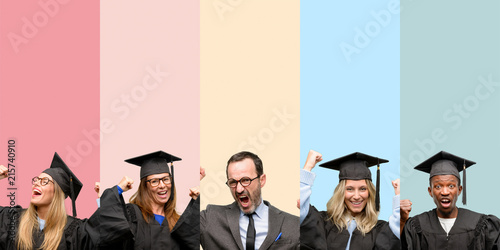 Senior teacher with his graduate students happy and excited celebrating victory expressing big success, power, energy and positive emotions. Celebrates new job joyful
