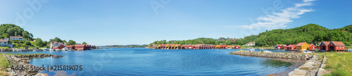 Panorama at the waterfront of Svennevik with its boat houses