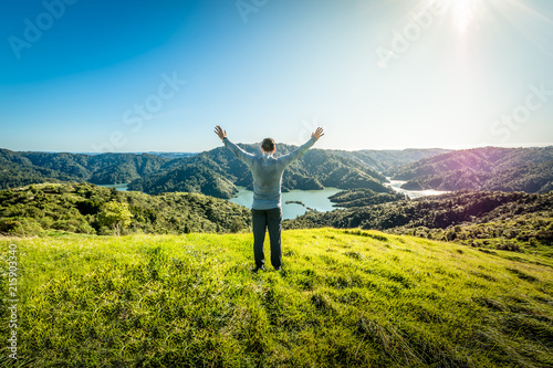 Hiker found a camping site on top of a mountain overlooking a beautiful lake