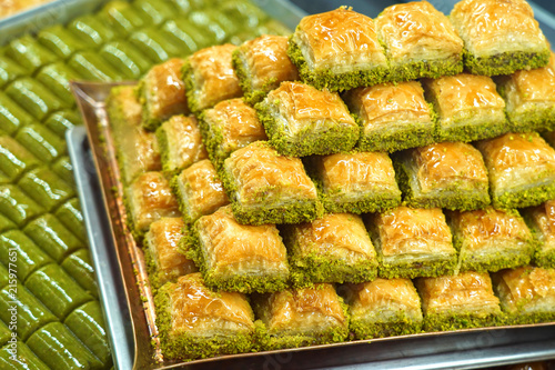 Traditional, delicious Turkish baklava and green pistachio nut sarma .