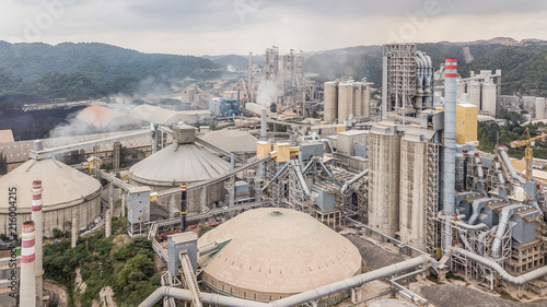 Aerial view cement plant factory manufacturing, Cement factory machinery on a blue sky background.